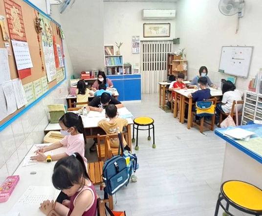 Teacher and students participating in a learning activity